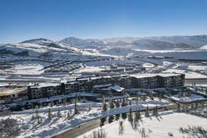 Snowy aerial view featuring a mountain view