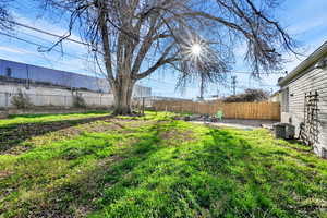 Fenced backyard with a patio