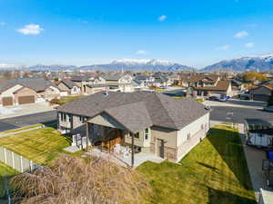 Aerial view of residential area featuring a mountain backdrop