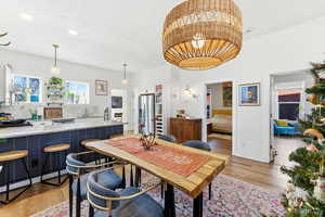 Dining room with light wood finished floors and baseboards