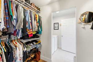 Spacious closet with separate washer and dryer