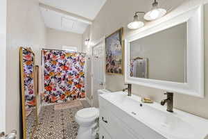 Full bath featuring a shower with curtain and vanity
