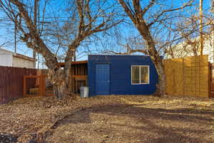 View of outbuilding with a fenced backyard