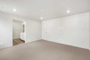 Unfurnished room with carpet flooring and recessed lighting