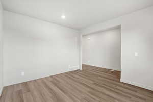 Spare room featuring light wood-style flooring