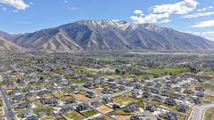 View of mountain backdrop featuring nearby suburban area