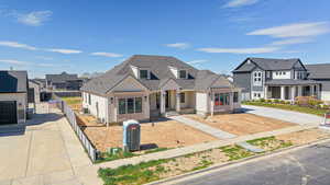 View of front of property with a residential view and driveway