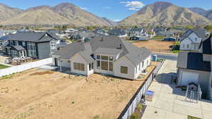 Aerial perspective of suburban area with a mountain backdrop