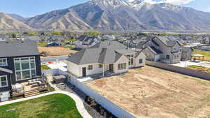 Aerial perspective of suburban area with a mountain backdrop