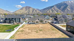 View of mountain backdrop with nearby suburban area