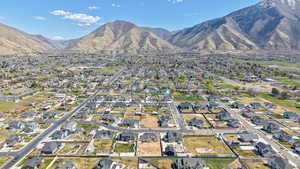 Aerial perspective of suburban area with a mountain backdrop