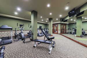 Gym featuring recessed lighting