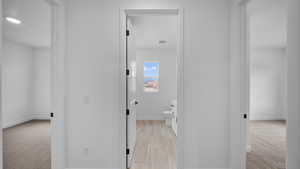 Bathroom featuring light colored carpet and vanity