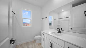 Full bathroom featuring vanity and toilet