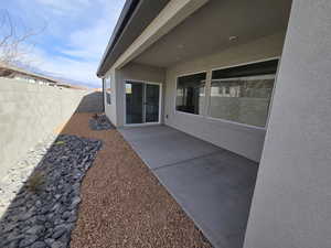 Fenced backyard with a patio and a mountain view