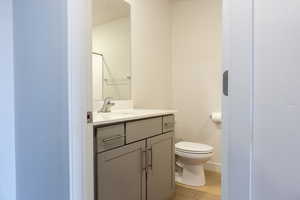 Bathroom with vanity and toilet
