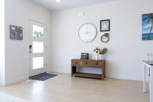 Entrance foyer featuring natural light and lvp finished floors