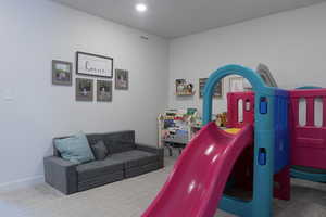 Rec room featuring carpet flooring and recessed lighting