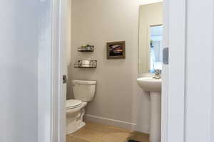 Bathroom featuring light wood finished floors and baseboards