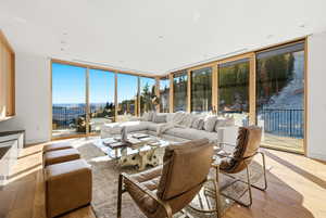 Living room with expansive windows and light wood-style floors