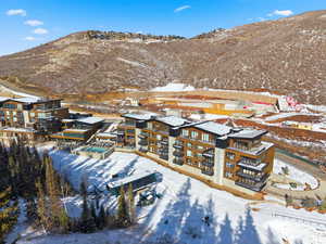 Snowy aerial view featuring a mountain view