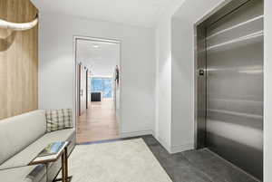 Hallway featuring elevator