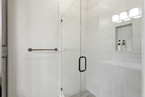 Bathroom featuring a shower stall