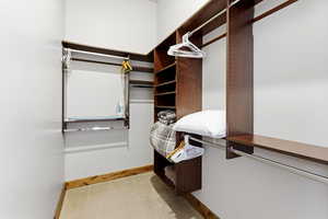 Spacious closet featuring carpet