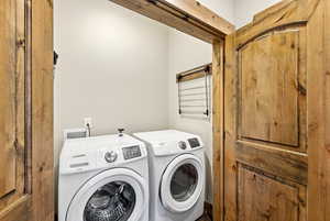 Laundry area featuring washer and clothes dryer