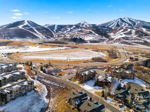 Snowy aerial view featuring a mountain view