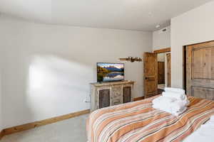 Bedroom with carpet and baseboards