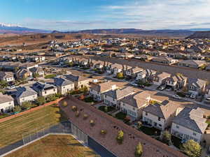 Aerial perspective of suburban area featuring a mountain backdrop