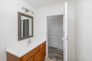 Bathroom featuring vanity and light wood-type flooring