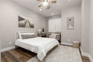 Bedroom featuring a ceiling fan, wood finished floors, and recessed lighting