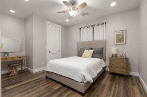 Bedroom featuring dark wood finished floors, ceiling fan, and recessed lighting