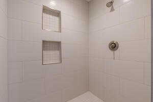 Full bath with a tile shower