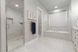 Bathroom with vanity, a bath, a shower stall, and recessed lighting