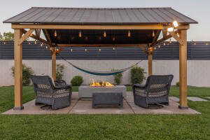 View of patio / terrace with an outdoor living space with a fire pit and a gazebo