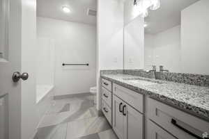 Full bathroom with vanity and washtub / shower combination