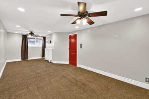 Carpeted empty room with recessed lighting and a ceiling fan