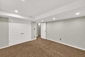 Finished below grade area with recessed lighting and carpet flooring