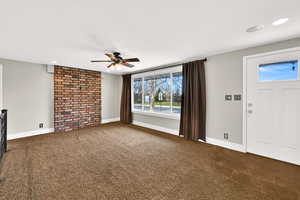 Unfurnished living room featuring recessed lighting, dark carpet, and ceiling fan