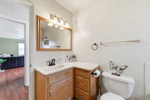 Bathroom with vanity and dark wood-type flooring