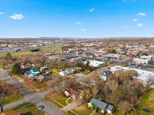 Aerial view of property's location featuring nearby suburban area