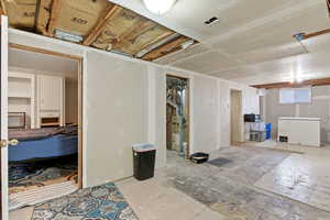 Basement with white refrigerator