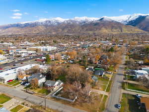 Aerial view of property's location with mountains and nearby suburban area