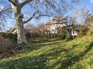View of backyard looking up at house