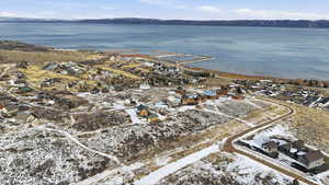 Aerial view of property's location with nearby suburban area and a water and mountain view