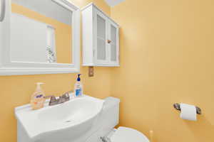 Half bath with vanity and toilet