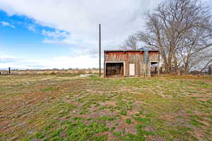 View of outdoor structure with a view of rural / pastoral area